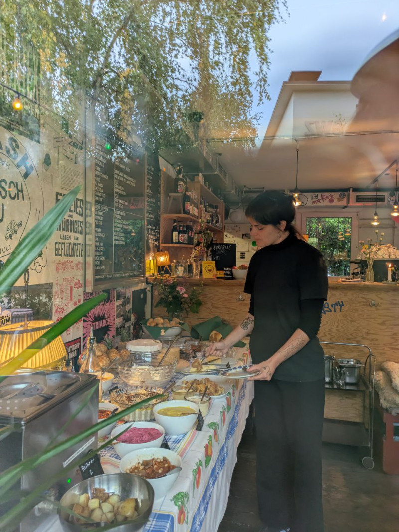 Person with huge menu in their hand